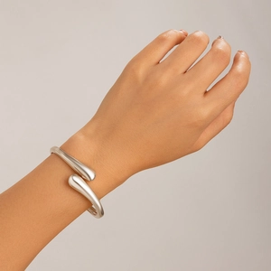 Irregular silver droplet cuff bracelet with a polished fluid wave design for women