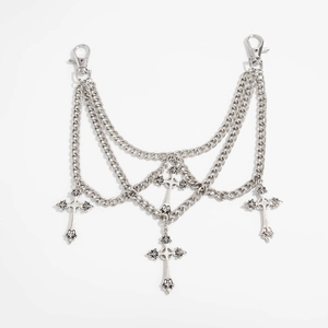 Detail view of multi-layer silver metal chain featuring four gothic cross pendants