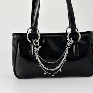 Glossy black handbag with punk silver chain tassels and metallic star pendants charm