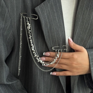 Silver punk hip hop brooch with multi-layer tassel chains and stars on grey suit lapel