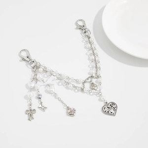 Y2K style pearl bead bag chain with silver heart charms and white ribbon bow
