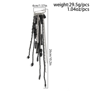 Detail of beaded tassel brooch with silver pins and black beads measuring 26cm in length