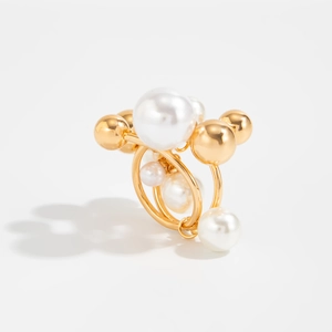 Elegant gold ring featuring a cluster of white pearls and polished metallic beads