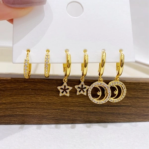 Gold plated hoop earring set with micro paved cubic zirconia star and moon charms