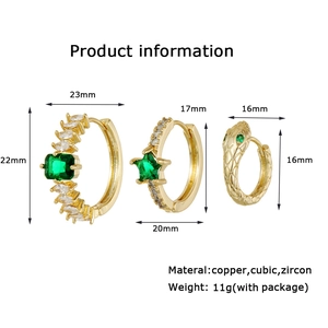 Detail showing three gold-plated copper earrings set with green cubic zirconia accents