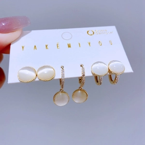 6-piece gold earring set with white cat eye stones and sparkling zircon accents