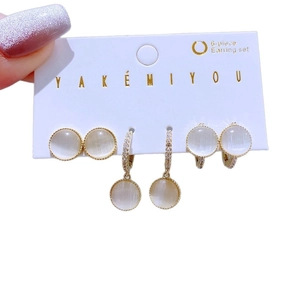 6-piece gold earring set with white cat eye stones and sparkling crystal accents