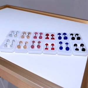 Detailed set of 12 pairs of sparkling crystal ball barbell earrings in six vibrant colors
