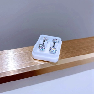 Detail of aurora crystal paved ball earrings with black titanium steel screw back studs