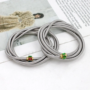 Detail showing two-piece silver snake chain bracelets with colorful zircon stones