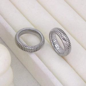Detailed view of silver-tone tubogas spiral rings with textured metallic finish