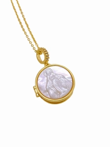 Detailed macro view of 18K gold locket necklace with pearl relief and cross chain