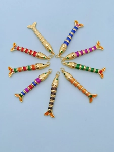 Collection of colorful enamel fish pendants in various patterns with golden finish
