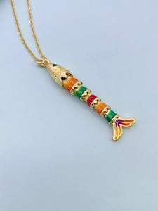 Detail showing colorful enamel koi fish pendant with articulated movable gold body segments