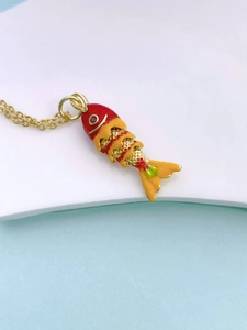 Articulated koi fish pendant with colorful enamel segments and a golden chain link