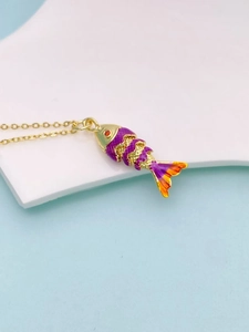 Detail of colorful articulated koi fish pendant with purple enamel and gold finish