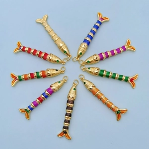 Colorful fish necklace pendants in vibrant enamel and gold finish with green gemstone eyes