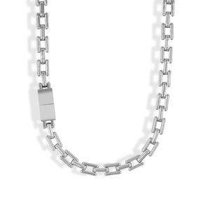 Detailed close-up of a silver stainless steel rectangular link chain necklace in minimalist style