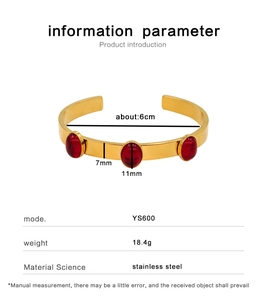 Detail view of gold stainless steel bangle with three red zircon stones and size dimensions