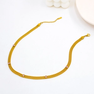 Detailed close-up of 18K gold plated mesh chain necklace with five pink zircon stones