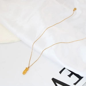 Elegant 18K gold-plated female figure pendant necklace on luxury white silk background