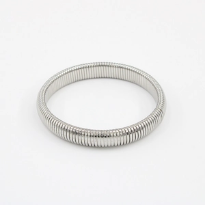 Detailed macro shot of silver stretchable stainless steel snake chain bangle texture