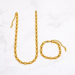 Close-up of 7mm gold plated necklace and bracelet set with round-cut sparkling crystals