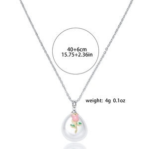 Detail view of pearl pendant with rose enamel decor and 40+6cm chain specs