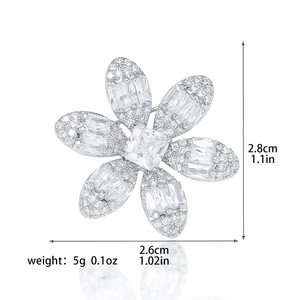 Exquisite silver floral brooch with shimmering crystals and dimensions 2.8cm x 2.6cm