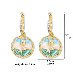 Detail view of retro flower earrings with enamel inlay and freshwater pearl accents