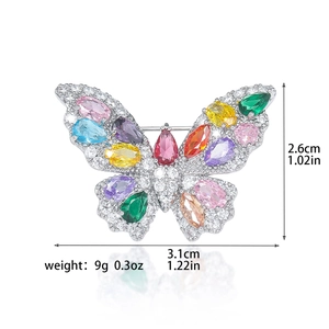 Elegant silver butterfly brooch with vibrant colorful cubic zirconia and crystal accents