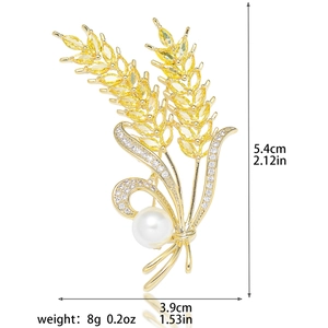 Detailed view of golden wheat brooch with yellow zircon, pearl, and size dimensions