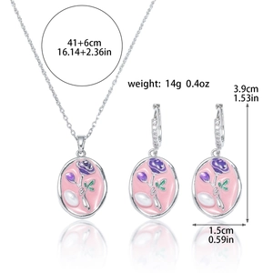 Detail of floral enamel necklace and earrings set with freshwater pearls and rose pattern
