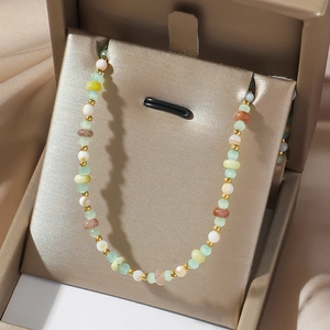 Minimalist titanium steel necklace with colorful natural stone beads on champagne satin
