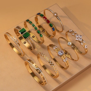 Luxurious gold-plated titanium steel bangles with emerald stones and Roman numerals set