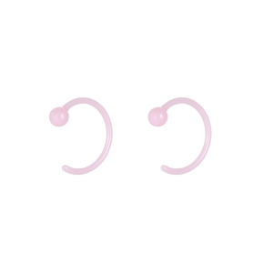 Detailed view of translucent light pink acrylic C-shaped nose rings with ball ends