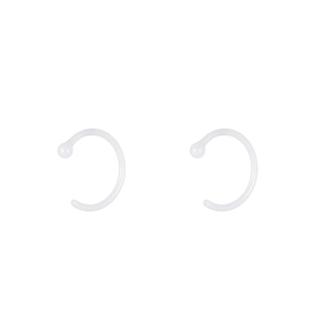 Detail view of clear acrylic C-shape ear plugs with smooth surface on white background