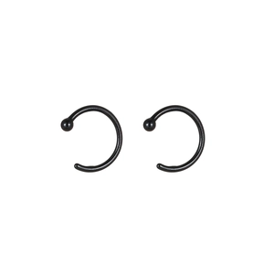 Pair of minimalist black C-shaped ceramic lip rings with metal ball end detail