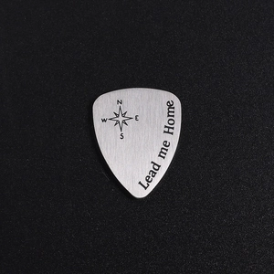 Polished titanium steel guitar pick with compass engraving and Lead me Home text