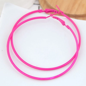 Macro shot of large rose red matte metal hoop earrings with secure click-top closure