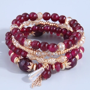 Deep red multi-layer beaded bracelet set with golden hollow tubes and crystal pendant