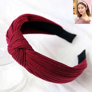 Knitted ribbed twist headband in wine red for women with non-slip inner grip and stylish knot