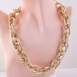 Chunky gold chain link necklace featuring polished and textured rings for women