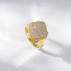 Macro shot of gold-plated square ring featuring pavé-set shimmering zircon stones