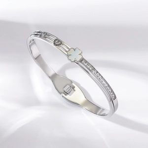 Detailed view of titanium steel clover bracelet with heart motifs and inset zirconias