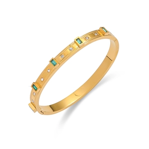 Titanium steel gold bangle featuring emerald green crystals and white zircon accents