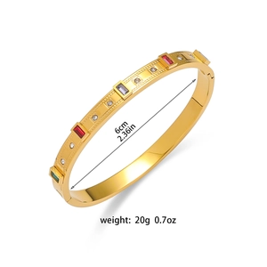 Titanium steel bangle with colorful square crystals and emerald green stones in gold finish
