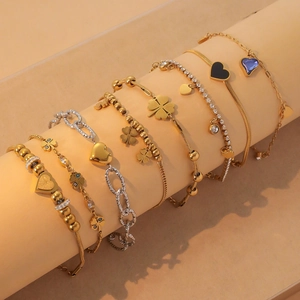 7-piece gold and silver bracelet set with colorful hearts and clover charms