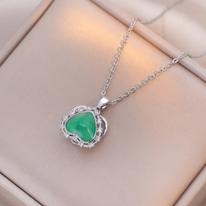 Silver-toned heart necklace featuring a green gemstone pendant surrounded by zircon stones