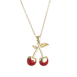 Minimalist gold necklace with a vibrant red cherry pendant and polished leaf detail